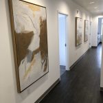 Hallway leading to the treatment rooms at {PRACTICE_NAME}