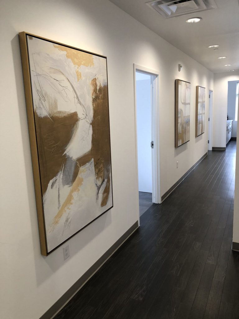 Hallway leading to the treatment rooms at {PRACTICE_NAME}